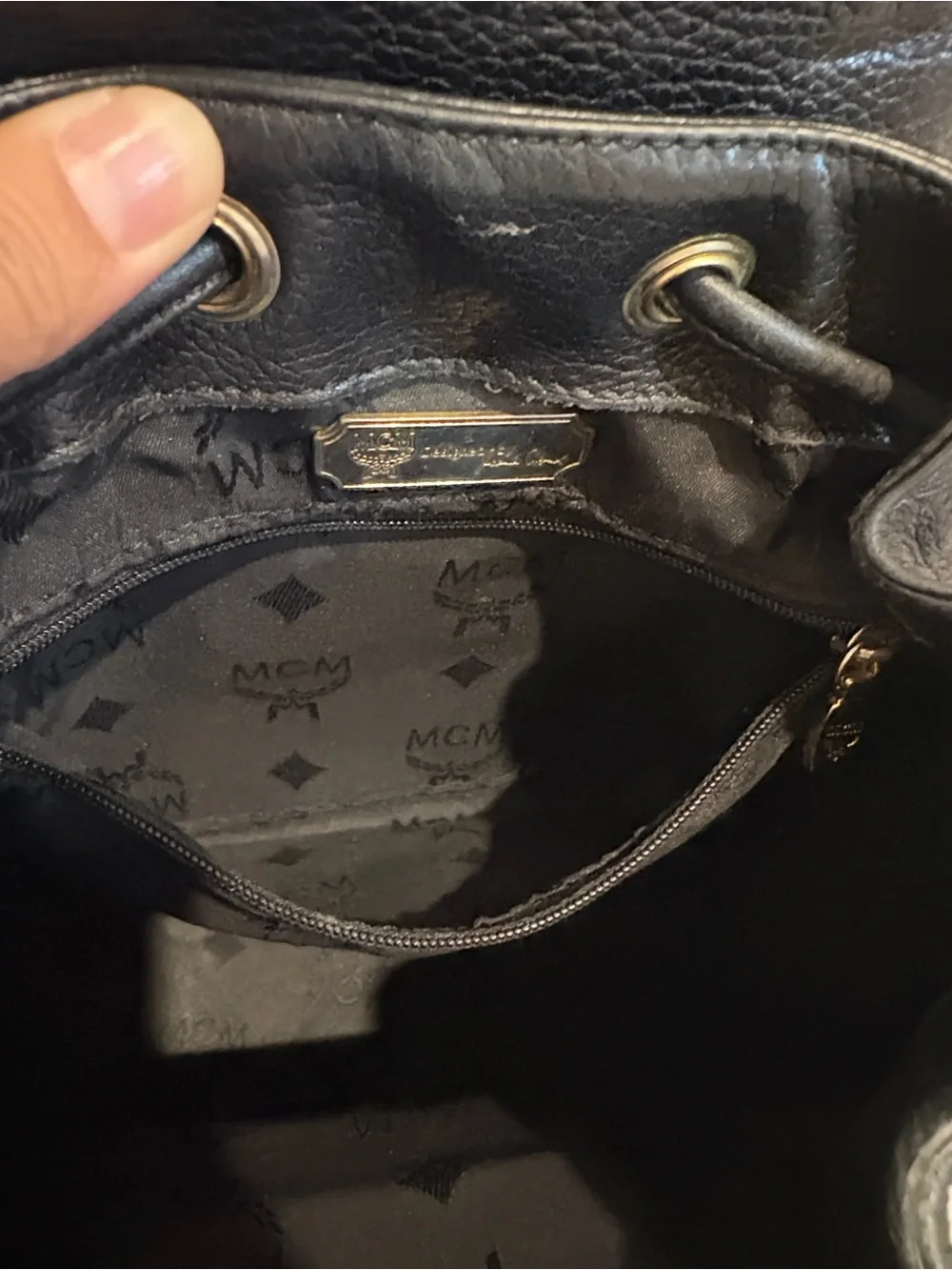 MCM Black Leather Drawstring Backpack with Gold Hardware